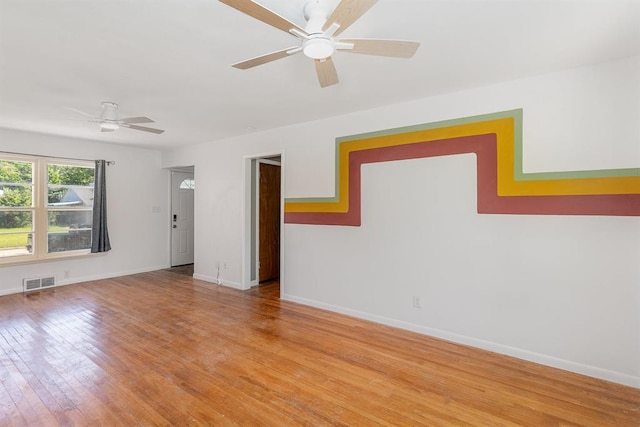 3032 NW 67th St, Oklahoma City, OK 73116 - unfurnished room with ceiling fan, light wood-style floors, and baseboards