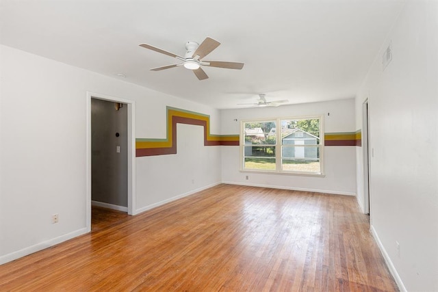 3032 NW 67th St, Oklahoma City, OK 73116 - unfurnished room with light wood-style flooring, ceiling fan, and baseboards
