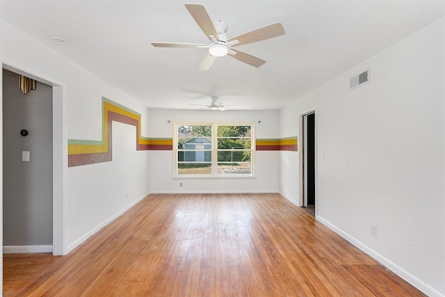 3032 NW 67th St, Oklahoma City, OK 73116 - spare room with light wood-style floors, a ceiling fan, and baseboards