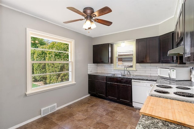 3032 NW 67th St, Oklahoma City, OK 73116 - kitchen with white appliances, a sink, tasteful backsplash, a ceiling fan, and baseboards