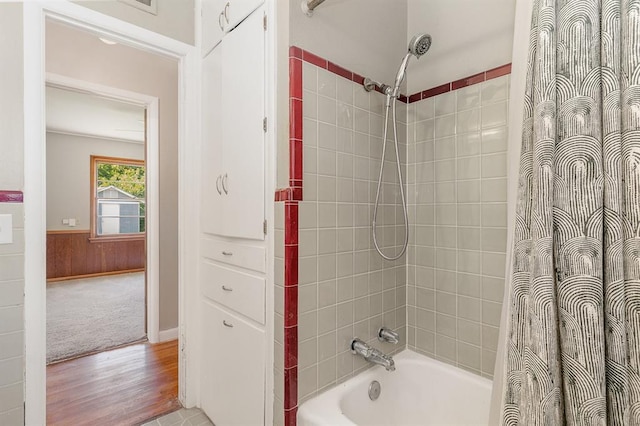 3032 NW 67th St, Oklahoma City, OK 73116 - bathroom with wood finished floors and shower / tub combo
