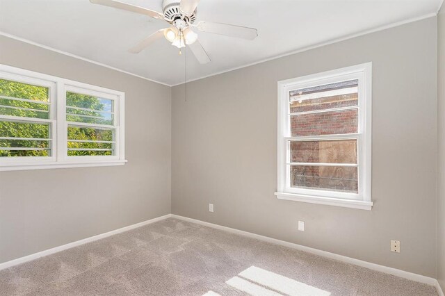3032 NW 67th St, Oklahoma City, OK 73116 - unfurnished room featuring healthy amount of natural light, carpet flooring, baseboards, and crown molding