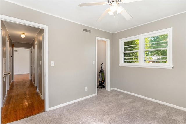 3032 NW 67th St, Oklahoma City, OK 73116 - unfurnished bedroom featuring baseboards, carpet, crown molding, a ceiling fan, and a closet