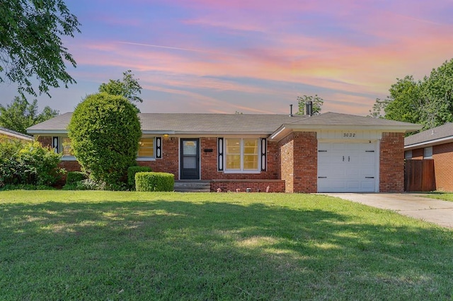 3032 NW 67th St, Oklahoma City, OK 73116 - ranch-style house featuring an attached garage, brick siding, and driveway