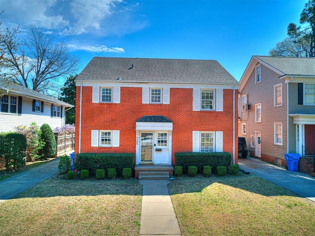 705 Chautauqua Ave, Norman, OK 73069 - view of front of property with brick siding and a front lawn