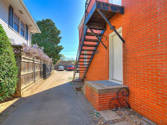 705 Chautauqua Ave, Norman, OK 73069 - view of side of home with stairs and brick siding