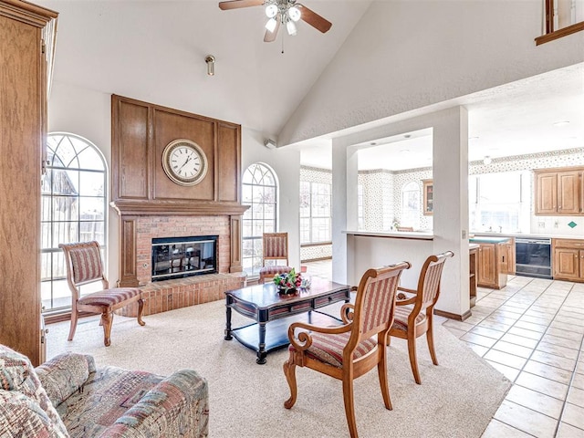 2616 Redvine Rd, Edmond, OK 73034 - living room featuring plenty of natural light, a ceiling fan, a brick fireplace, and high vaulted ceiling