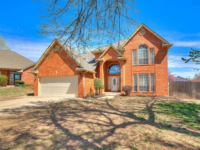 2616 Redvine Rd, Edmond, OK 73034 - traditional home with brick siding, a garage, and driveway