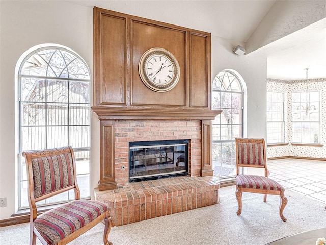 2616 Redvine Rd, Edmond, OK 73034 - carpeted living room featuring lofted ceiling and a fireplace