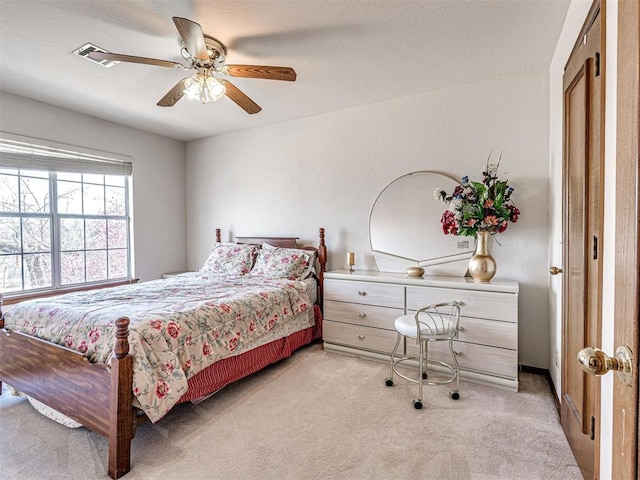 2616 Redvine Rd, Edmond, OK 73034 - bedroom featuring light colored carpet and ceiling fan