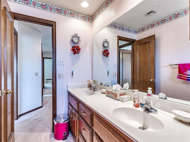 2616 Redvine Rd, Edmond, OK 73034 - full bathroom with double vanity, baseboards, and wallpapered walls