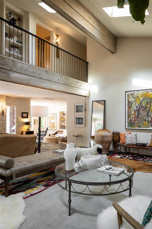 1917 Whispering Pines Cir, Norman, OK 73072 - living area featuring a towering ceiling and beam ceiling