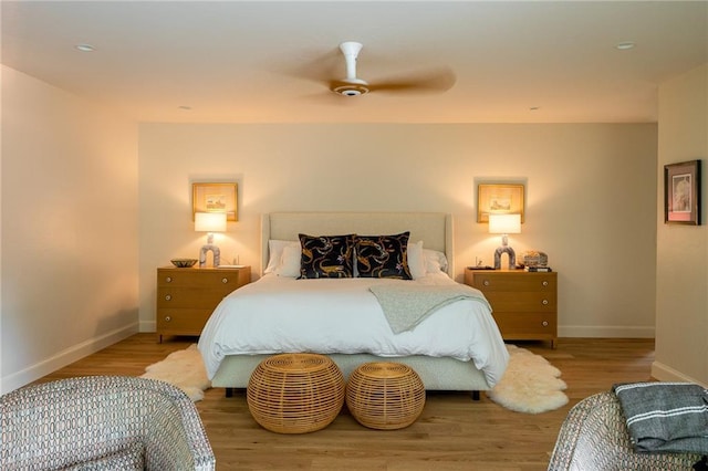 1917 Whispering Pines Cir, Norman, OK 73072 - bedroom with baseboards, wood finished floors, and a ceiling fan