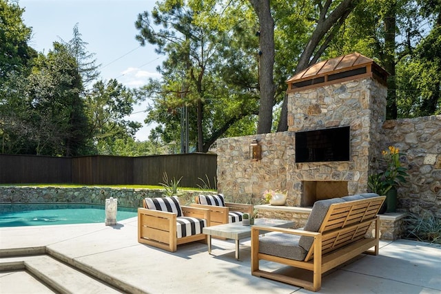 1917 Whispering Pines Cir, Norman, OK 73072 - fenced backyard featuring an outdoor stone fireplace and a patio