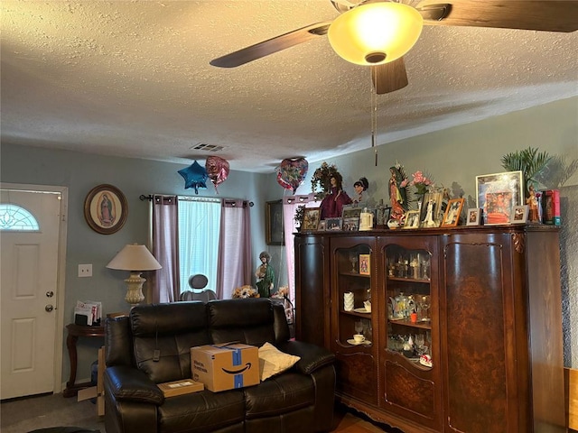 2508 N Cummings Dr, Oklahoma City, OK 73107 - living room with a textured ceiling, ceiling fan, and healthy amount of natural light