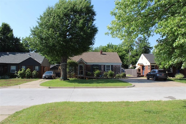 2508 N Cummings Dr, Oklahoma City, OK 73107 - ranch-style home with driveway and a chimney