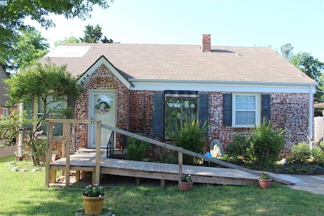 2508 N Cummings Dr, Oklahoma City, OK 73107 - view of front of property with brick siding, a front lawn, and a chimney