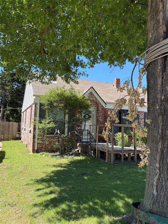 2508 N Cummings Dr, Oklahoma City, OK 73107 - view of front of property with brick siding and a chimney