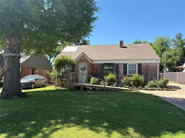 2508 N Cummings Dr, Oklahoma City, OK 73107 - view of front facade featuring brick siding and a chimney