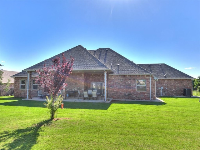 10716 Quail Reserve Rd, Oklahoma City, OK 73173 - rear view of property with a patio area, central AC, a shingled roof, and brick siding