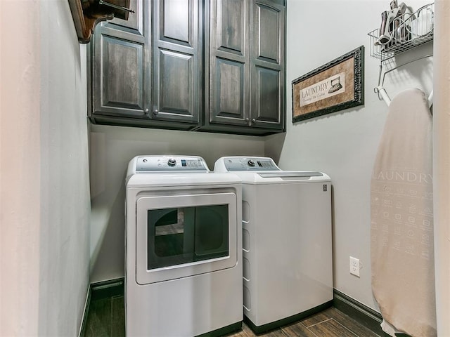 10716 Quail Reserve Rd, Oklahoma City, OK 73173 - laundry area with washing machine and dryer, cabinet space, wood finished floors, and baseboards
