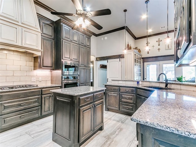 10716 Quail Reserve Rd, Oklahoma City, OK 73173 - kitchen featuring a sink, appliances with stainless steel finishes, ornamental molding, ceiling fan, and backsplash