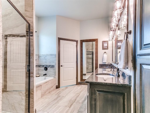 10716 Quail Reserve Rd, Oklahoma City, OK 73173 - full bath featuring a stall shower, a garden tub, and vanity