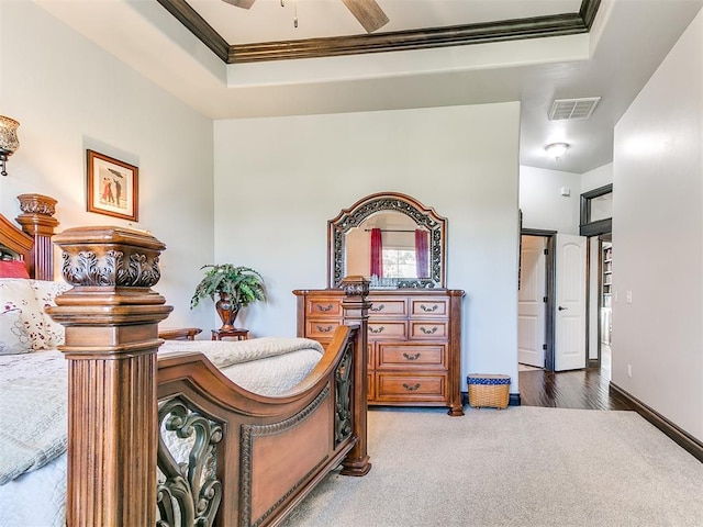 10716 Quail Reserve Rd, Oklahoma City, OK 73173 - carpeted bedroom with a raised ceiling and crown molding