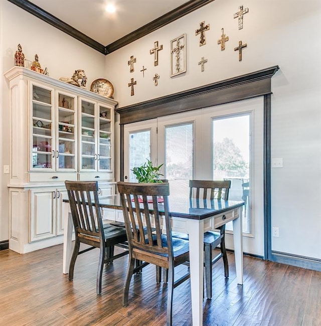 10716 Quail Reserve Rd, Oklahoma City, OK 73173 - dining room with ornamental molding, dark wood-style floors, healthy amount of natural light, and baseboards
