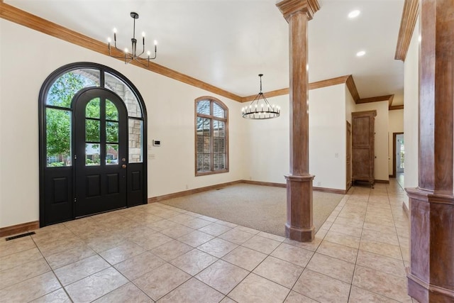 18617 Wolf Creek Dr, Edmond, OK 73012 - foyer entrance featuring ornate columns, a chandelier, light tile patterned flooring, ornamental molding, and recessed lighting