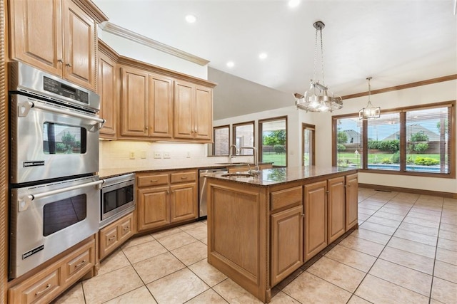 18617 Wolf Creek Dr, Edmond, OK 73012 - kitchen with appliances with stainless steel finishes, decorative backsplash, light tile patterned flooring, recessed lighting, and dark stone counters