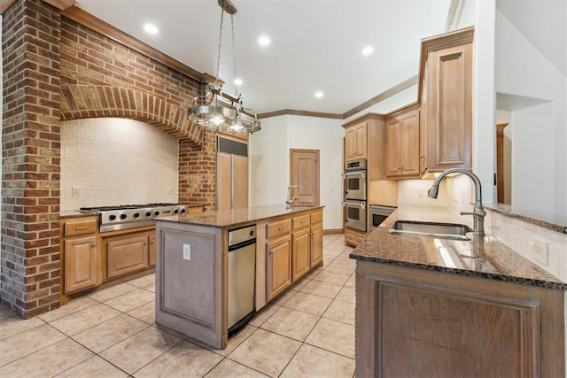 18617 Wolf Creek Dr, Edmond, OK 73012 - kitchen with a sink, stainless steel appliances, dark stone counters, decorative backsplash, and light tile patterned floors