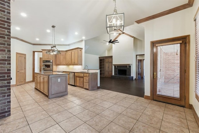 18617 Wolf Creek Dr, Edmond, OK 73012 - kitchen with appliances with stainless steel finishes, a chandelier, a sink, a ceiling fan, and light tile patterned floors