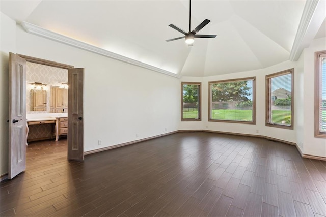 18617 Wolf Creek Dr, Edmond, OK 73012 - unfurnished room featuring a ceiling fan, dark wood-style floors, lofted ceiling, and baseboards