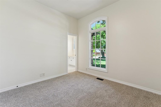 18617 Wolf Creek Dr, Edmond, OK 73012 - carpeted spare room with baseboards