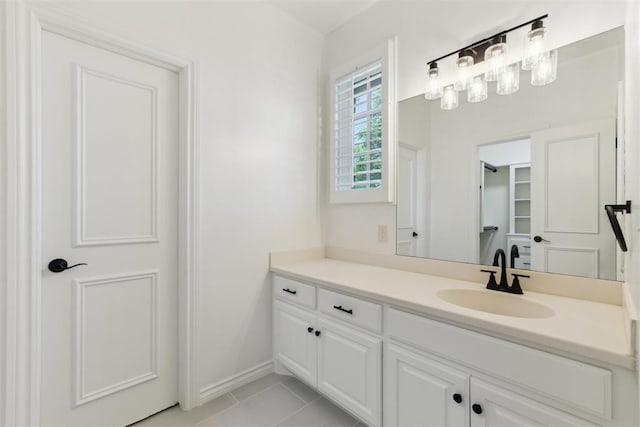 18617 Wolf Creek Dr, Edmond, OK 73012 - bathroom featuring vanity, tile patterned flooring, and baseboards