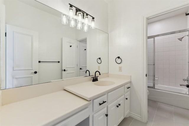 18617 Wolf Creek Dr, Edmond, OK 73012 - bathroom with vanity, tile patterned flooring, shower / bath combination, baseboards, and toilet