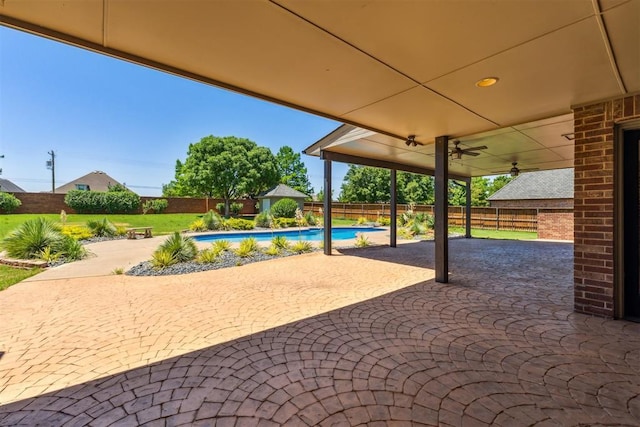 18617 Wolf Creek Dr, Edmond, OK 73012 - fenced backyard with a patio and ceiling fan
