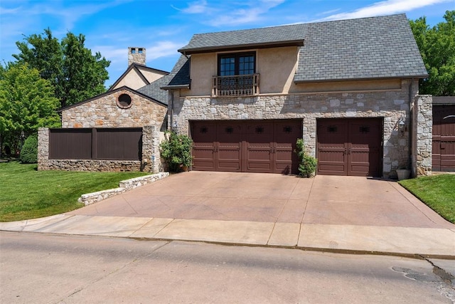 6638 Avondale Dr, Nichols Hills, OK 73116 - french country style house with stone siding, a front yard, stucco siding, and concrete driveway