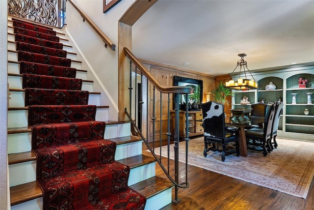 6638 Avondale Dr, Nichols Hills, OK 73116 - stairway with wood finished floors and crown molding