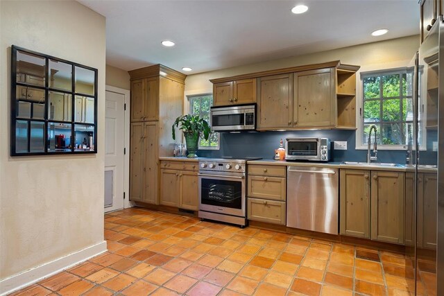 6638 Avondale Dr, Nichols Hills, OK 73116 - kitchen featuring stainless steel appliances, a sink, open shelves, recessed lighting, and backsplash
