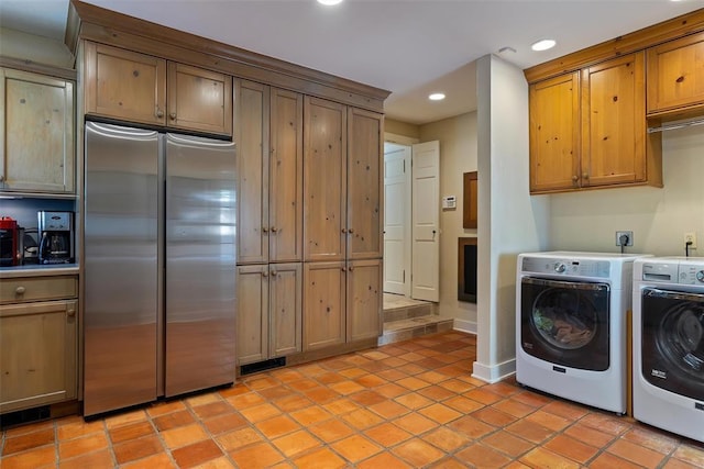 6638 Avondale Dr, Nichols Hills, OK 73116 - laundry area featuring washing machine and clothes dryer, recessed lighting, and light tile patterned floors