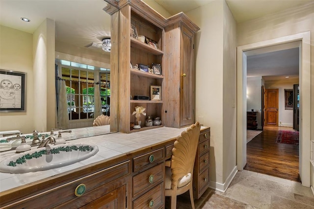 6638 Avondale Dr, Nichols Hills, OK 73116 - bathroom featuring vanity, stone finish floors, and baseboards