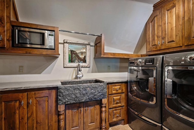 6638 Avondale Dr, Nichols Hills, OK 73116 - laundry room with cabinet space and washing machine and clothes dryer
