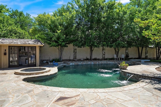 6638 Avondale Dr, Nichols Hills, OK 73116 - view of pool with a pool with connected hot tub, a patio, and an outbuilding