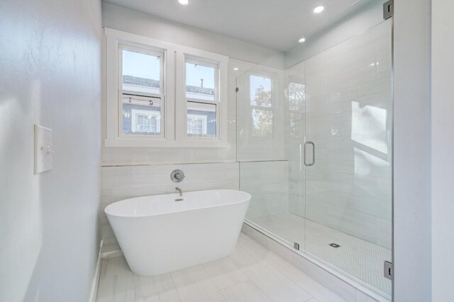 108 NW 25th St, Oklahoma City, OK 73103 - bathroom featuring a stall shower, a soaking tub, tile patterned floors, and recessed lighting