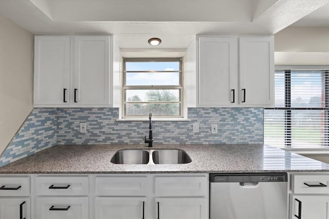 7 Concord Blvd, Shawnee, OK 74804 - kitchen featuring stainless steel dishwasher, a sink, tasteful backsplash, white cabinets, and light stone counters