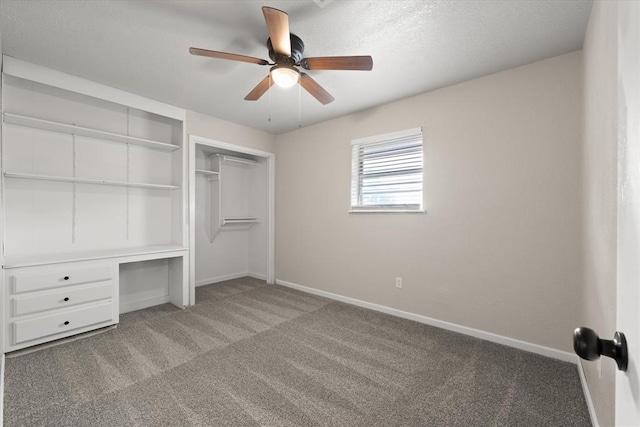 7 Concord Blvd, Shawnee, OK 74804 - unfurnished bedroom with carpet flooring, baseboards, a closet, a ceiling fan, and a textured ceiling