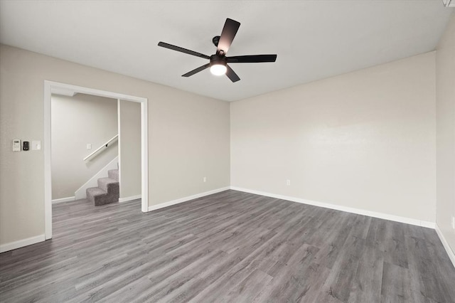 7 Concord Blvd, Shawnee, OK 74804 - unfurnished room featuring wood finished floors, a ceiling fan, stairs, and baseboards