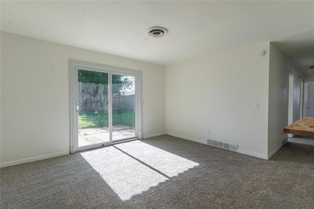 1524 Hampton Dr, Del City, OK 73115 - spare room featuring carpet flooring and baseboards
